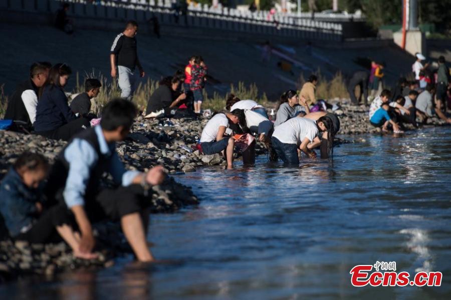 People celebrate the Karma Dunba (The Bathing Festival) in the Lhasa River in Lhasa City, Southwest China’s Tibet Autonomous Region, Sept. 15, 2018. Legend has it bathing during the period is beneficial to health. (Photo: China News Service/He Penglei)