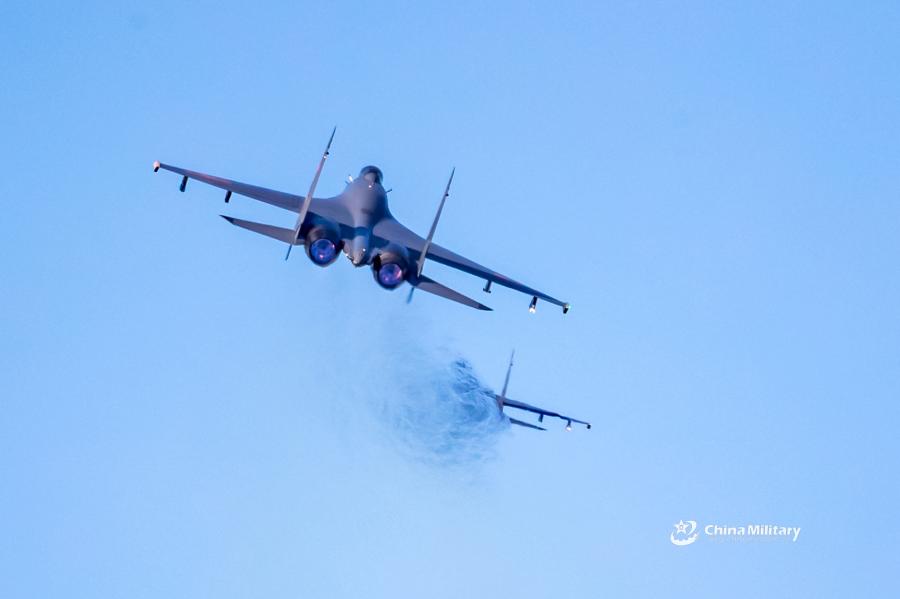 Two J-11B fighter jets attached to an aviation brigade of the air force under the PLA Northern Theater Command take off in formation for sorties during a recent round-the-clock flight training exercise. (Photo/eng.chinamil.com.cn)