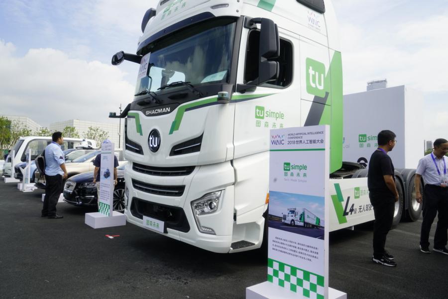 Automated driving vehicles are displayed in the AI Park Interactive Displays section during the World Artificial Intelligence Conference 2018 in Shanghai on Sept 18. The types of vehicles on show include sedans, buses, sanitation trucks and delivery vehicles. (Photo provided to chinadaily.com.cn)