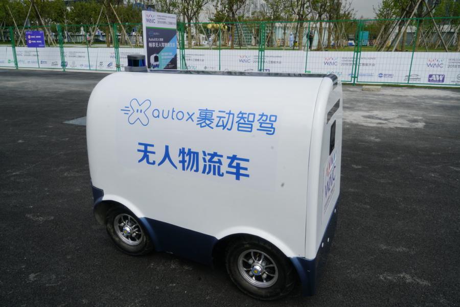 Automated driving vehicles are displayed in the AI Park Interactive Displays section during the World Artificial Intelligence Conference 2018 in Shanghai on Sept 18. The types of vehicles on show include sedans, buses, sanitation trucks and delivery vehicles. (Photo provided to chinadaily.com.cn)