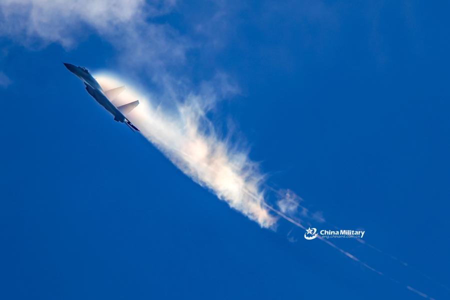 A J-11B fighter jet attached to an aviation brigade of the air force with the PLA Northern Theater Command performs the stiff pitch during a recent round-the-clock flight training exercise. (Photo/eng.chinamil.com.cn)