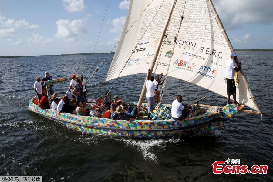 People take part in the first voyage sail of Flipflopi, the first dhow boat made entirely of recycled plastic, after the launch ceremony on the island of Lamu, Kenya, Sept. 15, 2018. Kenyan islanders have built a boat made entirely of recycled plastic collected during clean-ups of the ocean to highlight the growing menace of plastic waste that ends up in the sea.(Photo/Agencies)