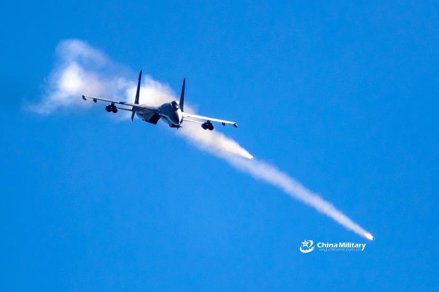 A J-11B fighter jet attached to an aviation brigade of the air force with the PLA Northern Theater Command shoots a flare off during a recent round-the-clock flight training exercise. (Photo/eng.chinamil.com.cn)