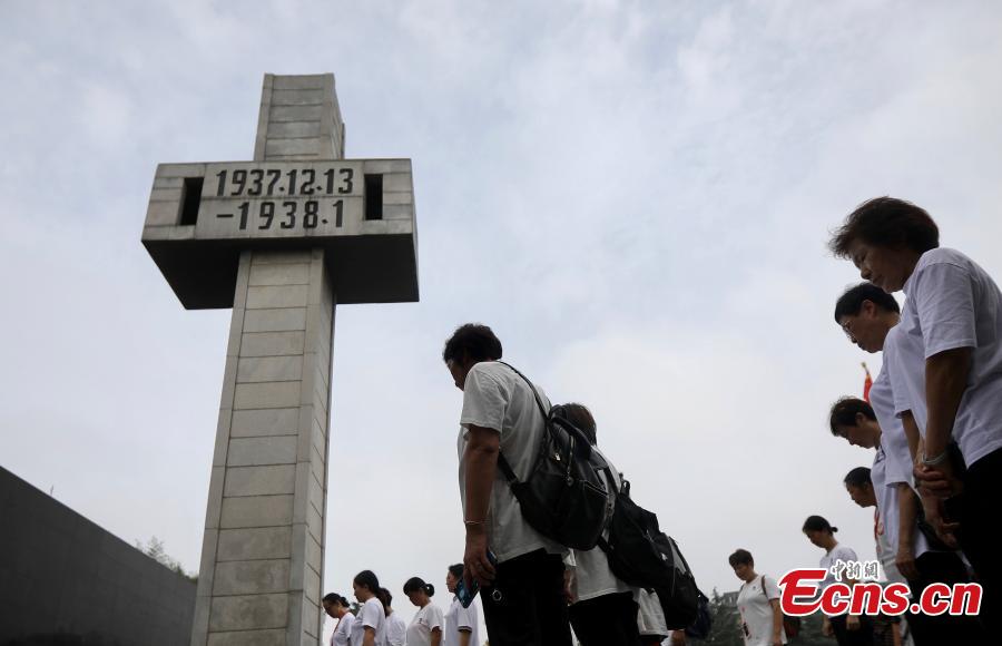 Visitors pause to mourn the deceased in silence at the Memorial Hall of the Victims in Nanjing Massacre by Japanese Invaders in Nanjing City, Jiangsu Province, Sept. 18, 2018. On September 18, 1931, the Japanese Kwantung Army stationed in northeast China destroyed a section of the railway near Liutiaohu and then falsely accused the Chinese military of causing the explosion. Using this as a pretext, the Japanese then bombarded Shenyang and began invasion of northeast China. (Photo: China News Service/Yang Bo)