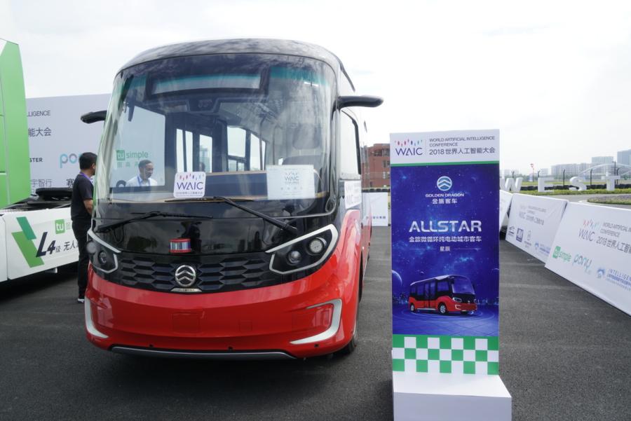 Automated driving vehicles are displayed in the AI Park Interactive Displays section during the World Artificial Intelligence Conference 2018 in Shanghai on Sept 18. The types of vehicles on show include sedans, buses, sanitation trucks and delivery vehicles. (Photo provided to chinadaily.com.cn)