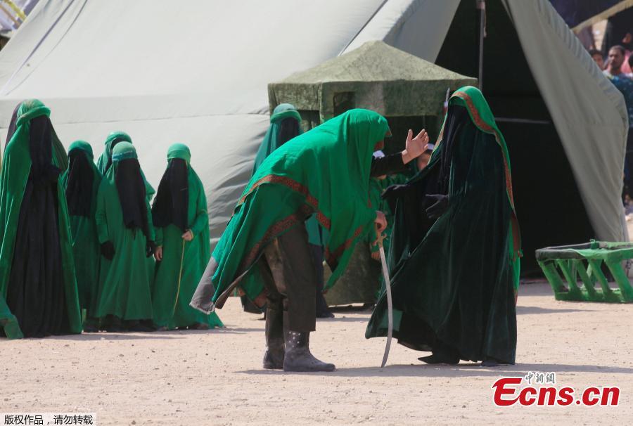 Local actors dressed as ancient warriors re-enact a scene from the 7th century battle of Karbala to commemorate Ashura in Najaf, Sept. 20, 2018. (Photo/Agencies)