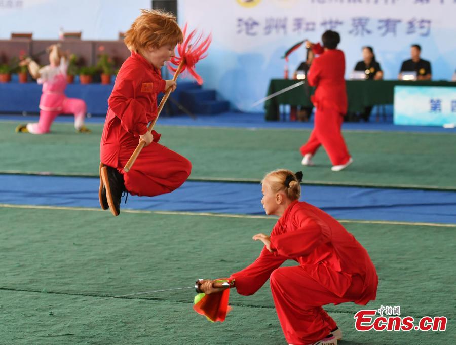 Two foreign participants perform at the 10th Cangzhou International Wushu Festival in Cangzhou City, North China’s Hebei Province, Sept. 20, 2018. Some 2,200 participants from 50 countries and regions will participate in the contest from Sept. 19 to 22. The festival helps promote cultural exchange and better understanding of martial arts. Cangzhou is one of the birthplaces of Chinese martial arts and is also known for its acrobatics. (Photo: China News Service/Zhai Yujia)