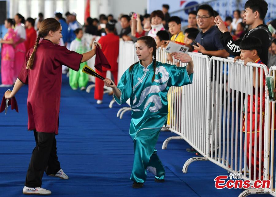 Two foreign participants perform at the 10th Cangzhou International Wushu Festival in Cangzhou City, North China’s Hebei Province, Sept. 20, 2018. Some 2,200 participants from 50 countries and regions will participate in the contest from Sept. 19 to 22. The festival helps promote cultural exchange and better understanding of martial arts. Cangzhou is one of the birthplaces of Chinese martial arts and is also known for its acrobatics. (Photo: China News Service/Zhai Yujia)