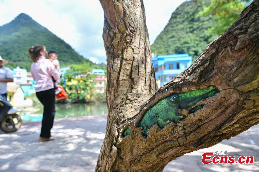 A view of the colorful buildings at Heye Village in Guangnan County, Southwest China’s Yunnan Province, Sept. 20, 2018. A group of artists began painting buildings and trees in different colors one month ago in order to help attract tourists to the village. (Photo: China News Service/Ren Dong)
