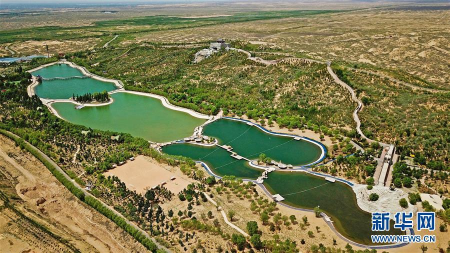 A photo taken May 25 shows Baijitan national desert park in Lingwu county, Ningxia Hui autonomous region. (Photo/Xinhua)

The 81,800-hectare Baijitan National Nature Reserve in Lingwu is on the edge of the Maowusu Desert, which covers an area of more than 40,000 square kilometers. The gradually expanding desert has been a critical problem constraining regional development since the 1950s. Statistics show that some 42,000 hectares of forests have been cultivated over the past 60 years, controlling more than 60,000 hectares of sand. Currently, the forest coverage of the reserve has reached 40.6 percent.