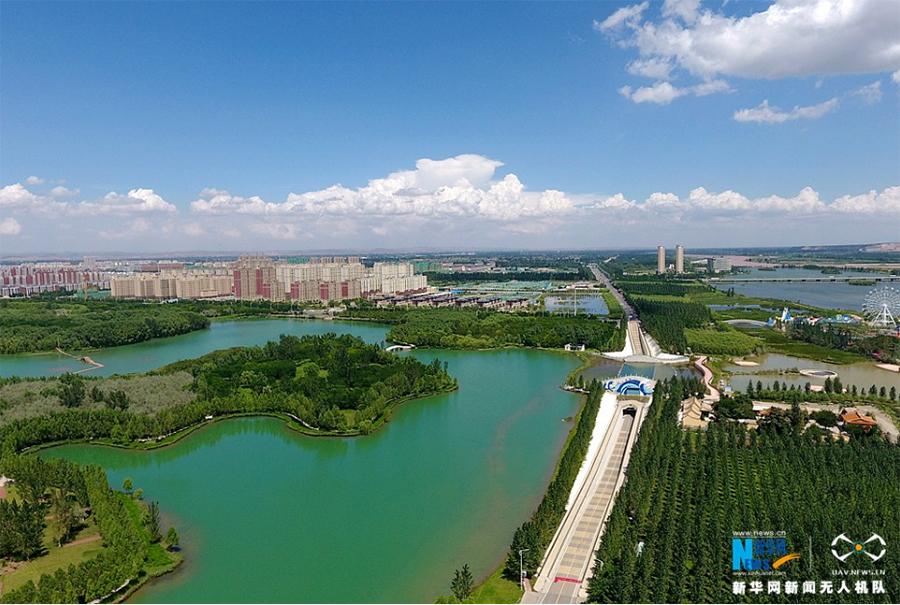 A photo taken Aug 27 shows Xiangshan Lake national wetland park in Zhongwei city, Ningxia Hui autonomous region. (Photo/Xinhua)

In the 1950s, when the desert was around 5 kilometers away, even a gentle breeze would blow dust and sand into the homes of residents in Zhongwei, who have suffered from desertification for decades. Now the situation has improved significantly. Desertification is under control and the distance between the desert and Zhongwei has lengthened to more than 20 kilometers.