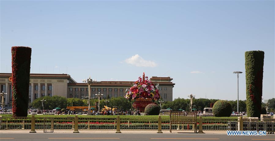Workers set up decorating parterres on the Tian\'anmen Square in Beijing, capital of China, Sept. 21, 2018. Decorating parterres are set up in Beijing to greet the National Day, which falls on Oct. 1. (Xinhua/Liang Zhiqiang)