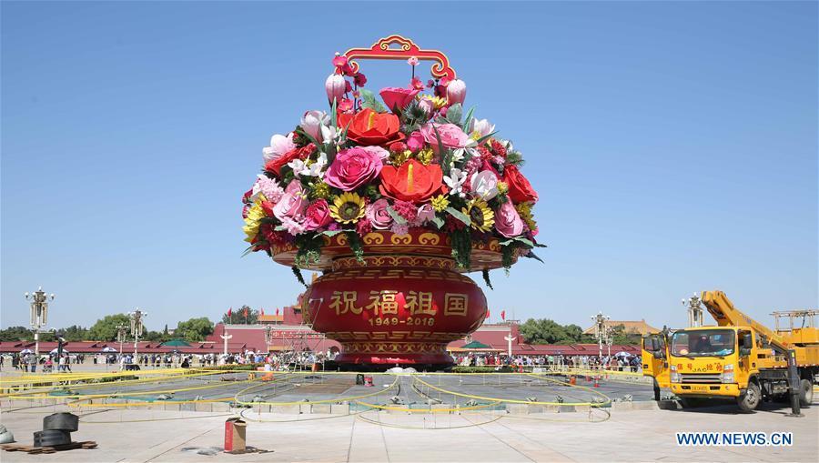 Workers set up a large decorating parterre on the Tian\'anmen Square in Beijing, capital of China, Sept. 21, 2018. Decorating parterres are set up in Beijing to greet the National Day, which falls on Oct. 1. (Xinhua/Liang Zhiqiang)