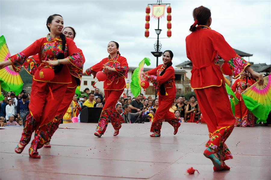 Villagers perform a lantern dance to celebrate China\'s first Farmers\' Harvest Festival in Majiazhai Village of Shuiwei Township in Cengong County, southwest China\'s Guizhou Province, Sept. 23, 2018. People across China hold various activities to celebrate the country\'s first Farmers\' Harvest Festival, which falls on Sept. 23 this year. (Xinhua/Yang Wenbin)