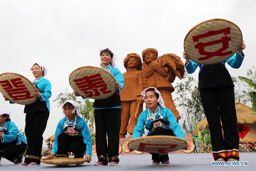 Villagers dance in celebration of China\'s first Farmers\' Harvest Festival in Baping Village of Mangchang Township in Nandan County, Hechi, south China\'s Guangxi Zhuang Autonomous Region, Sept. 23, 2018. People across China hold various activities to celebrate the country\'s first Farmers\' Harvest Festival, which falls on Sept. 23 this year. (Xinhua/Fu Longqiang)