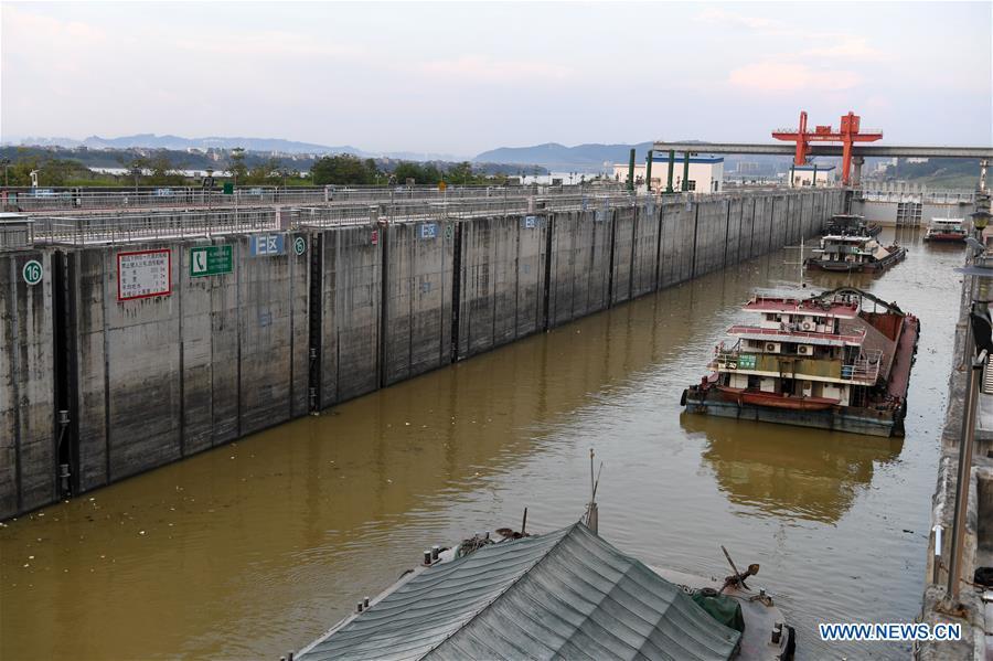 Cargo vessels pass the ship lock at the Changzhou reservoir, a water conservancy project on the Xijiang River, in Wuzhou, south China\'s Guangxi Zhuang Autonomous Region, Sept. 21, 2018. Xijiang River is an important trade route in southwest China. (Xinhua/Zhou Hua)
