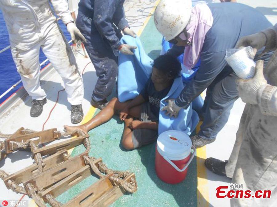 In this undated photo released by Indonesian Consulate General in Osaka, Aldi Novel Adilang sits on the deck of a Panamanian-flagged vessel, MV Arpeggio after being rescued in the waters near Guam. An Indonesian teenager is telling an extraordinary story of how he survived seven weeks adrift at sea. Aldi Novel Adilang, 19, worked alone on a wooden fishing raft called a \