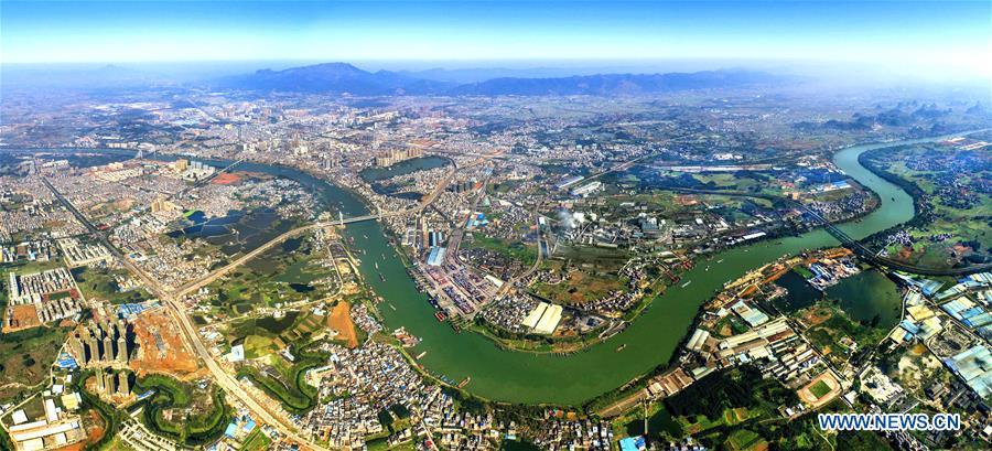Aerial photo taken on March 9, 2018 shows the view of Guigang City along the Xijiang River, south China\'s Guangxi Zhuang Autonomous Region. Xijiang River is an important trade route in southwest China. (Xinhua/Zhou Hua)