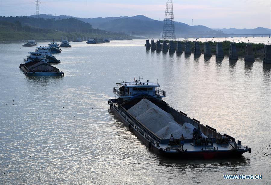 Cargo vessels pass the ship lock at the Changzhou reservoir, a water conservancy project on the Xijiang River, in Wuzhou, south China\'s Guangxi Zhuang Autonomous Region, Sept. 21, 2018. Xijiang River is an important trade route in southwest China. (Xinhua/Zhou Hua)