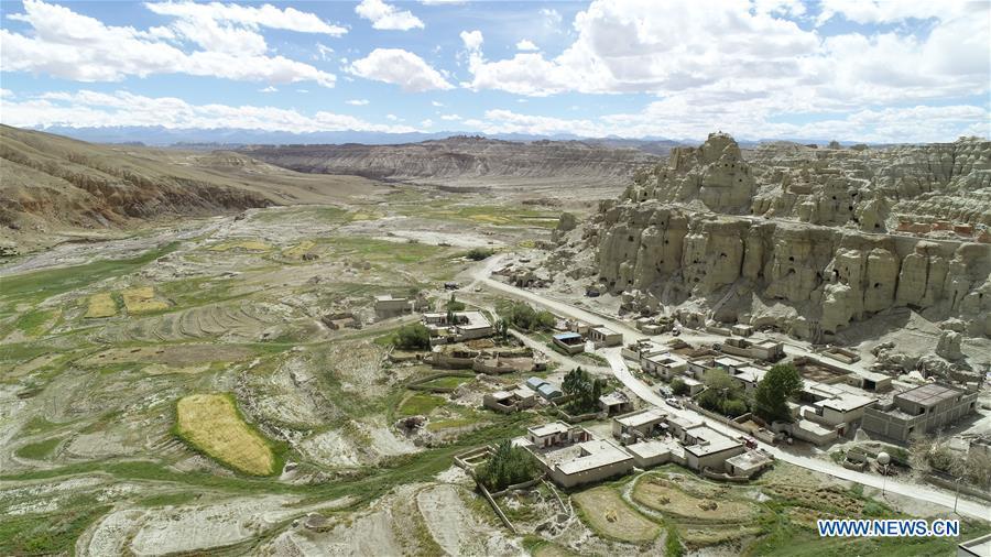 Aerial photo taken on Sept. 11, 2018 shows the ancient grottoes of Donggar on the hills in Ngari, southwest China\'s Tibet Autonomous Region. The Ngari area has an average altitude of over 4,000 meters above sea level. (Xinhua/Purbu Zhaxi)