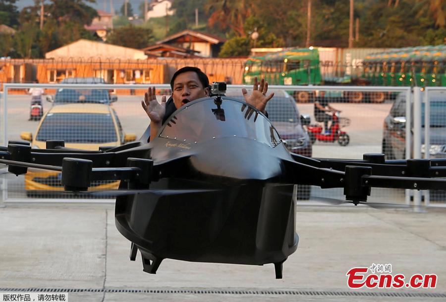 Kyxz Mendiola gestures after testing his flying car invention in the province of Batangas, Philippines, September 23, 2018. Former dancer and camera operator Kyxz Mendiola flew and hovered for a few minutes in a single-passenger contraption powered by the “multicopter” technology commonly used in small unmanned drones. (Photo/Agencies)