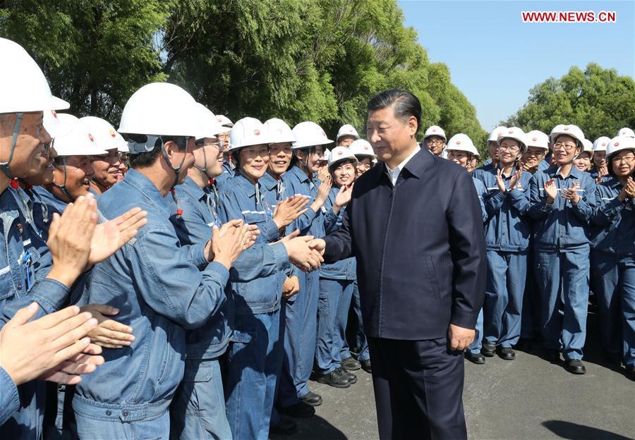 Chinese President Xi Jinping, also general secretary of the Communist Party of China (CPC) Central Committee and chairman of the Central Military Commission, shakes hands with workers during his visit to China National Petroleum Corporation (CNPC) Liaoyang Petrochemical Company in Liaoyang, northeast China\'s Liaoning Province, Sept. 27, 2018. Xi started an inspection tour in Liaoning on Thursday. (Xinhua/Ju Peng)
