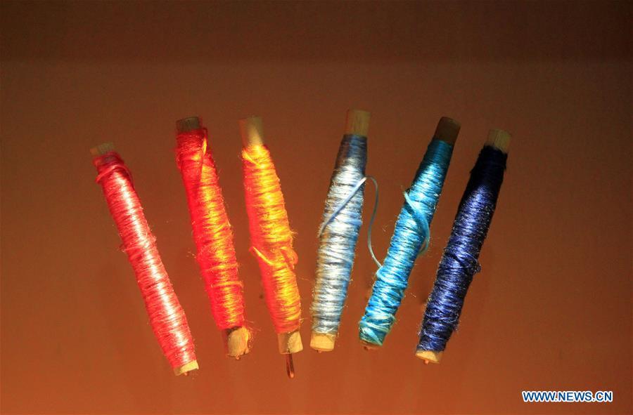 Photo taken on Sept. 26, 2018 shows colorful silk threads used for weaving Yun brocade at the Nanjing Yunjin Museum in Nanjing, capital of east China\'s Jiangsu Province. Yunjin, also called Yun brocade, is traditional Chinese silk brocade made in Nanjing of Jiangsu. Dated from the Eastern Jin Dynasty, it has formed its own characteristics through its development of 1,600 years. Yun brocade is famous for its exquisite craft, elegant patterns and smooth texture, and the making of the artwork requires close cooperation of two weavers, who can produce only five centimeters a day. In 2009, Yun brocade was inscribed on the Representative List of the Intangible Cultural Heritage of Humanity. (Xinhua/Sui Xiankai)