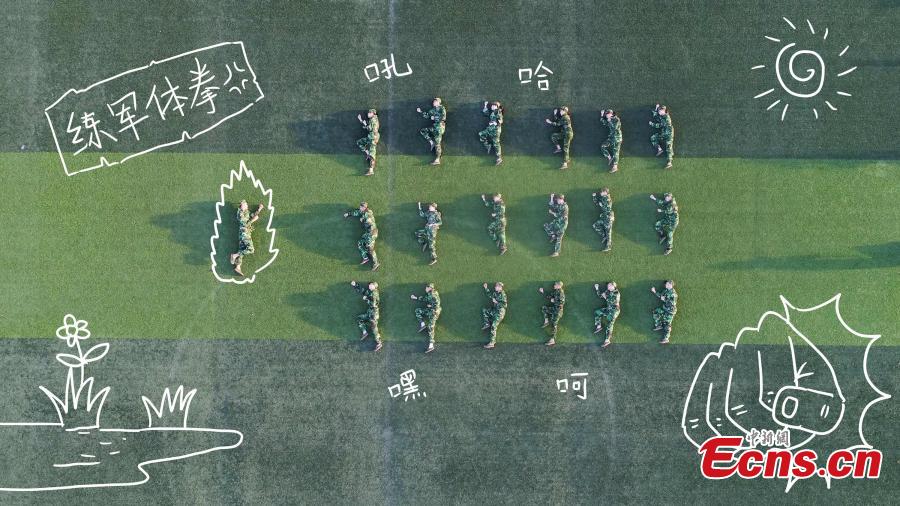 Drone photos show freshmen students of Fujian Normal University posing to form different patterns to mark their military training experience in Fuzhou City, East China’s Fujian Province. A total of 128 students lied on the ground or stood up to form numbers, Chinese characters and images in the creation. (Photo: China News Service/Chen Kekan)