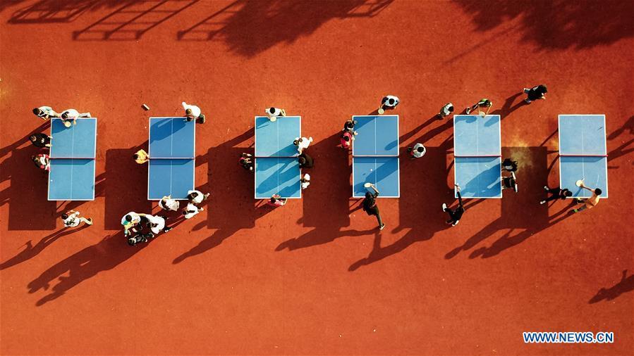 Aerial photo taken on Sept. 26, 2018 shows students playing table tennis at Xiaogang Primary School in Xiaogang Village of Fengyang County, east China\'s Anhui Province. Xiaogang, known as cradle of China\'s rural reform, witnessed great change in the past 40 years. (Xinhua/Zhang Duan)