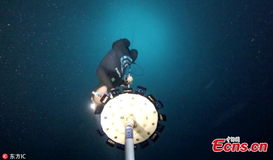 This is the incredible moment a woman breaks a world record by swimming more than 107 meters  in a free dive. Alessia Zecchini, from Rome, Italy, held her breath for more than three and a half minutes as she swam almost the length of a football field. (Photo/IC)