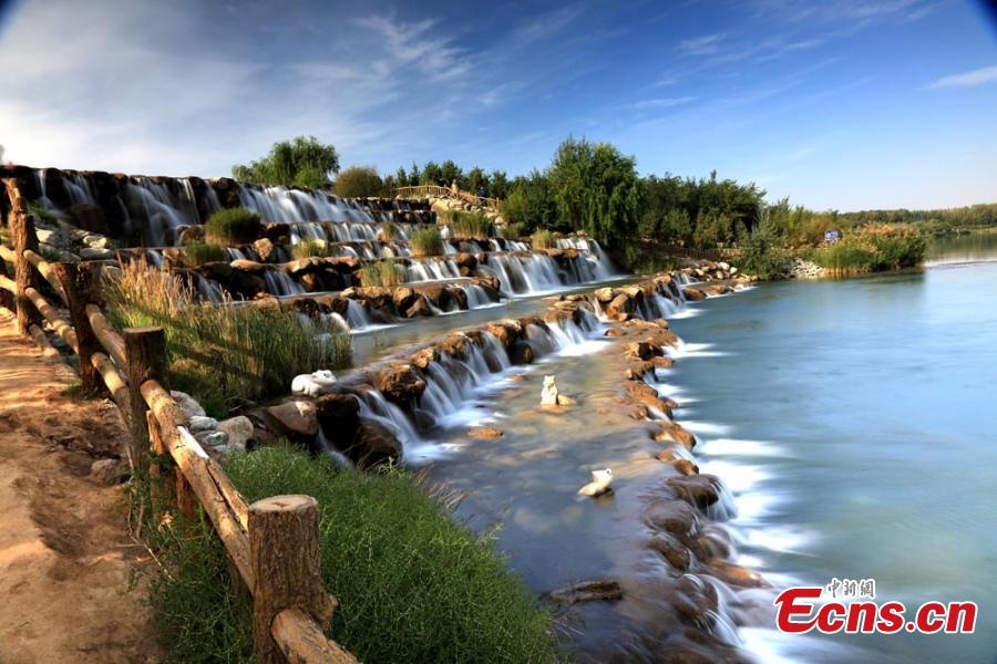 A view of the natural wonders in Zhangye City, Northwest China’s Gansu Province.  As leaves turn from green to yellow or red, the Hexi Corridor, part of the historic Silk Road, shows a stunning autumn scenery under the blue sky. (Photo: China News Service/Chen Li)