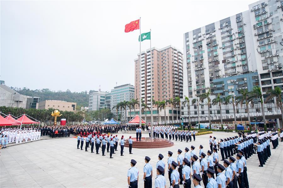A national flag raising ceremony is held at the Golden Lotus Square in Macao, south China, on Oct. 1, 2018, the National Day, to celebrate the 69th anniversary of the founding of the People\'s Republic of China. (Xinhua/Cheong Kam Ka)
