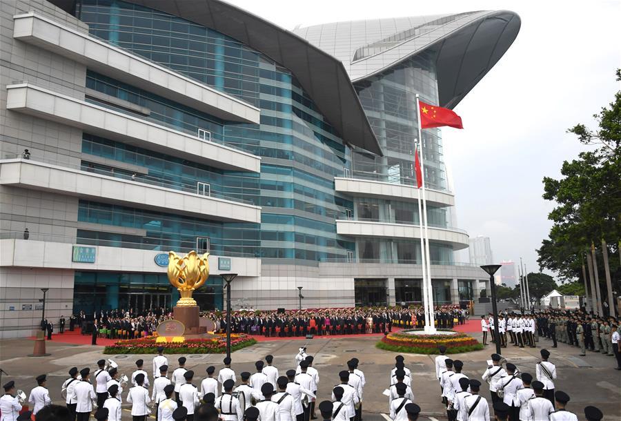 A national flag raising ceremony is held at the Golden Bauhinia Square in Hong Kong, south China, on Oct. 1, 2018, the National Day, to celebrate the 69th anniversary of the founding of the People\'s Republic of China. (Xinhua/Lui Siu Wai)