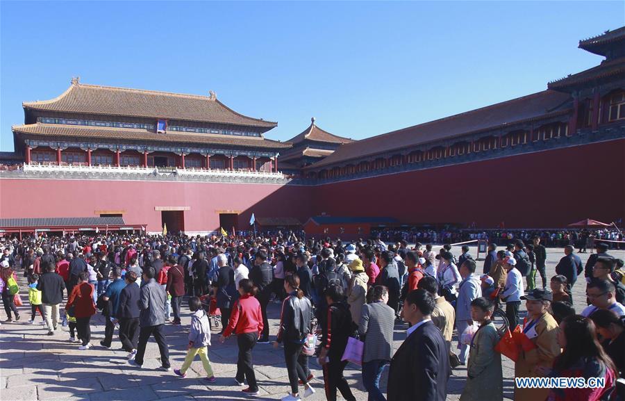 Tourists visit the Palace Museum in Beijing, capital of China, Oct. 2, 2018. Scenic spots across the country witnessed a peak of tourists on Tuesday. (Xinhua/Chen Xiaogen)