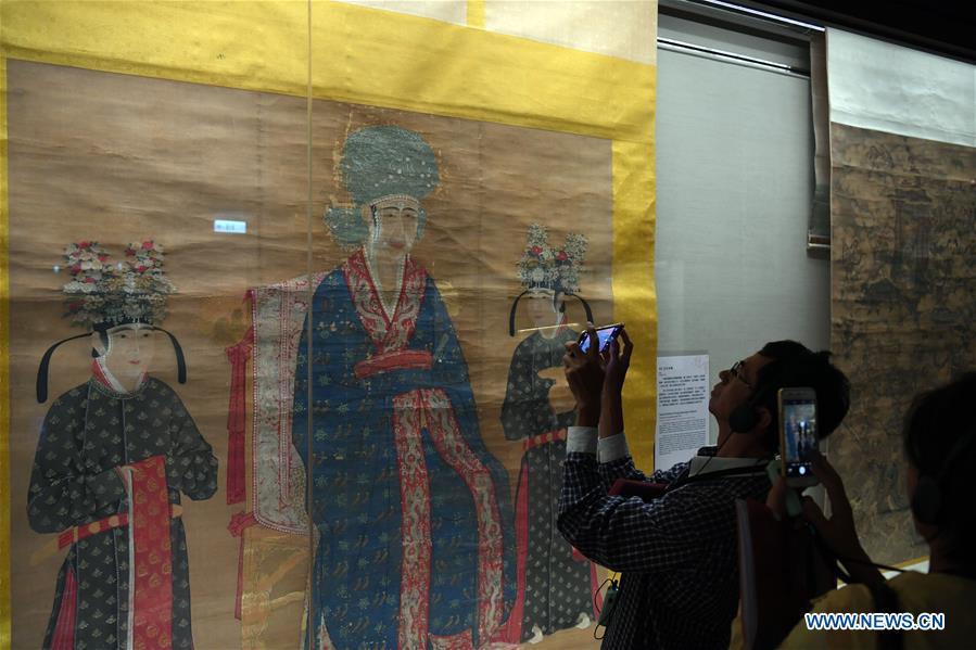 A journalist takes photos of \
