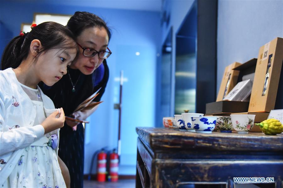Visitors view the tea set displayed at the Beijing Design Week in Beijing, capital of China, Oct. 4, 2018. The Beijing Design Week, a platform aimed at promoting the concept of a sustainable development of creative and design industry, last from Sept. 22 to Oct. 7. (Xinhua/Li Mangmang)