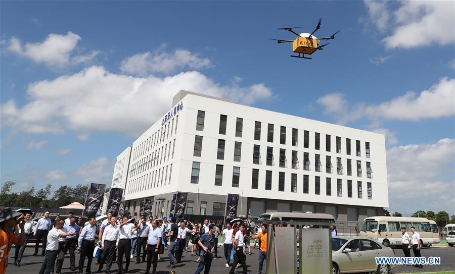 A drone carrying takeout flies above East China Unmanned Aerial Vehicles (UAV) Base in Shanghai, east China, Aug. 30, 2018. The UAV Base with airspace of 58 square kilometers for test-fly opened here on Aug. 30. The establishment of the base aims to boost the development of drone industry in Shanghai and East China. (Xinhua/Fang Zhe)