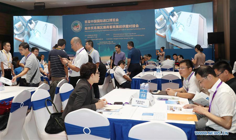 Enterprise representatives attend the Matchmaking Meeting for Exhibitors and Buyers of Trade in Services Exhibition Area of the 2018 China International Import Expo in Shanghai, east China, Aug. 30, 2018. (Xinhua/Fang Zhe)