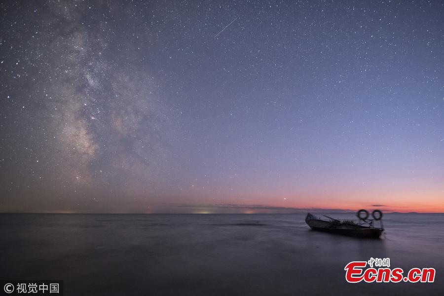 A photo taken on Oct. 3 and 4, 2018 shows the stars in the Milk Way over Xingkai Lake on the border between China and Russia, in Jixi City, Northeast China’s Heilongjiang Province. The lake is known as a great place to observe the stars at night. (Photo/VCG)