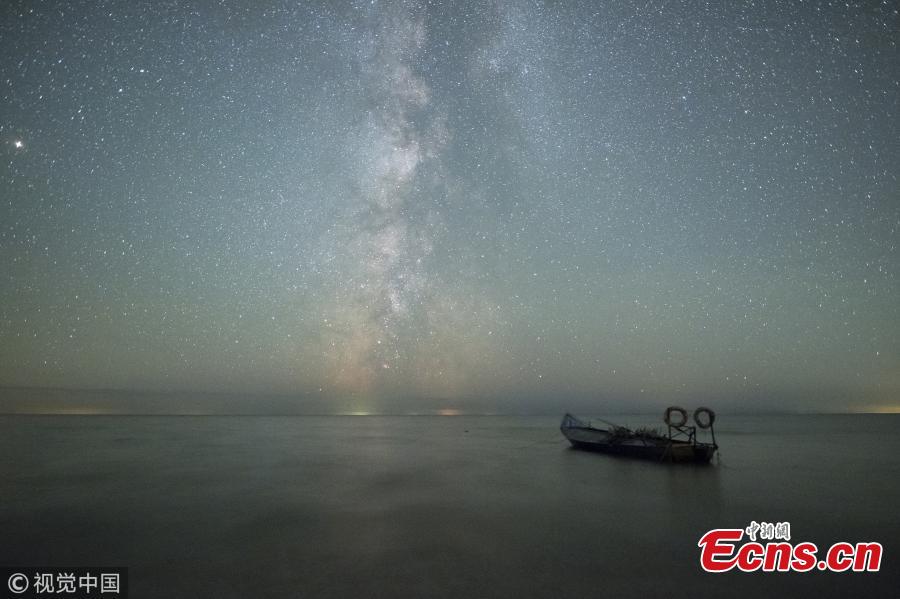 A photo taken on Oct. 3 and 4, 2018 shows the stars in the Milk Way over Xingkai Lake on the border between China and Russia, in Jixi City, Northeast China’s Heilongjiang Province. The lake is known as a great place to observe the stars at night. (Photo/VCG)