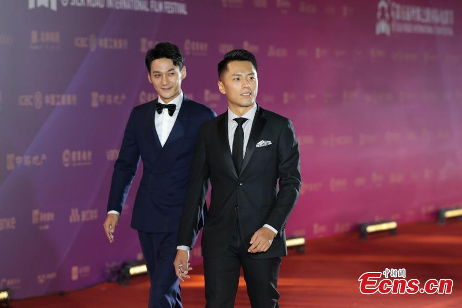Actors walk on the red carpet at the 5th Silk Road International Film Festival in Xi’an City, Northwest China’s Shaanxi Province, Oct. 8, 2018. (Photo: China News Service/Zhang Yuan)