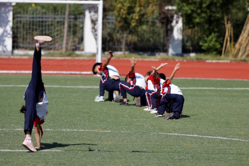 Xiaogang School students in a part-time martial arts class do exercises on Sept. 27. (Photo/chinadaily.com.cn)