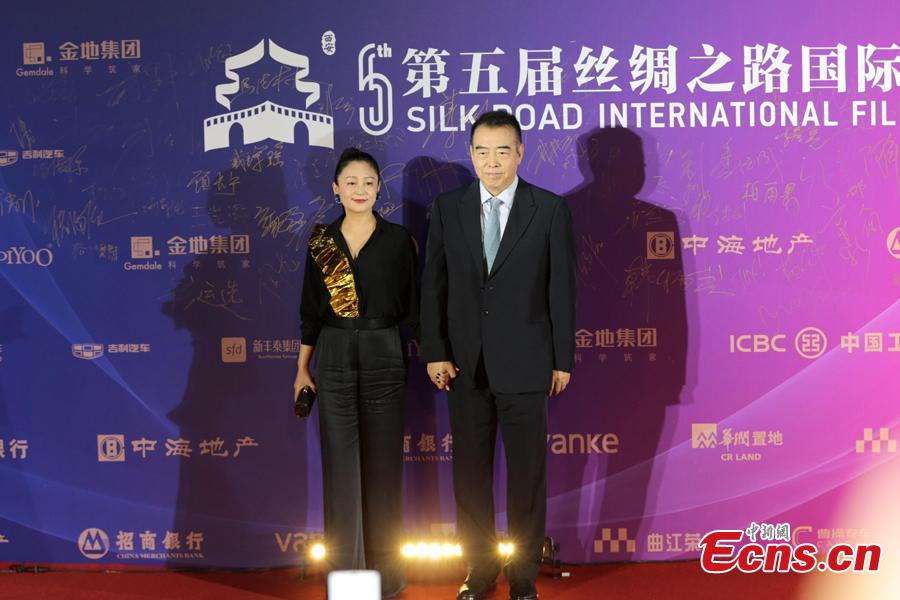 Chinese film director Chen Kaige and wife Chen Hong walk on the red carpet at the 5th Silk Road International Film Festival in Xi’an City, Northwest China’s Shaanxi Province, Oct. 8, 2018. (Photo: China News Service/Zhang Yuan)