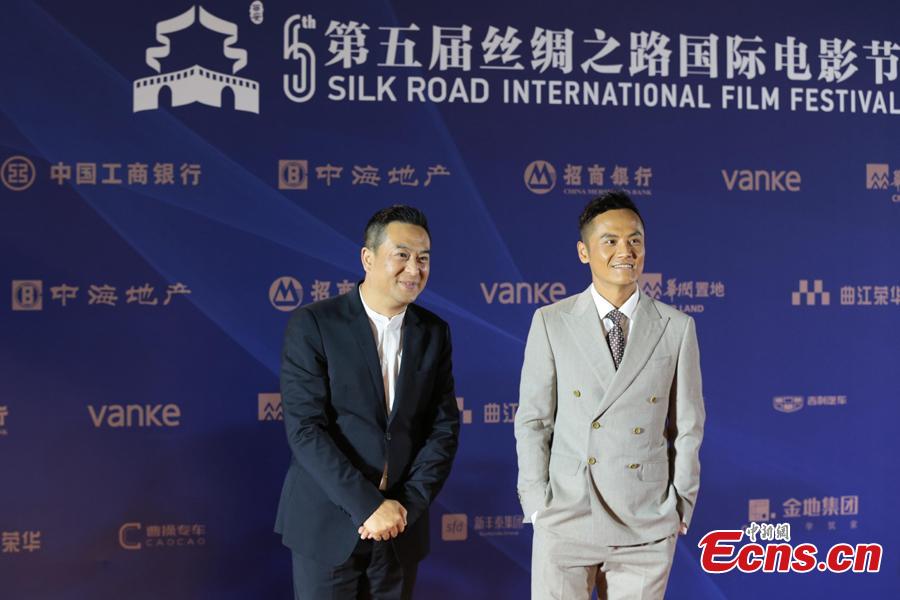 Chinese actor Zhang Jiayi (L) takes part in the 5th Silk Road International Film Festival in Xi’an City, Northwest China’s Shaanxi Province, Oct. 8, 2018. (Photo: China News Service/Zhang Yuan)