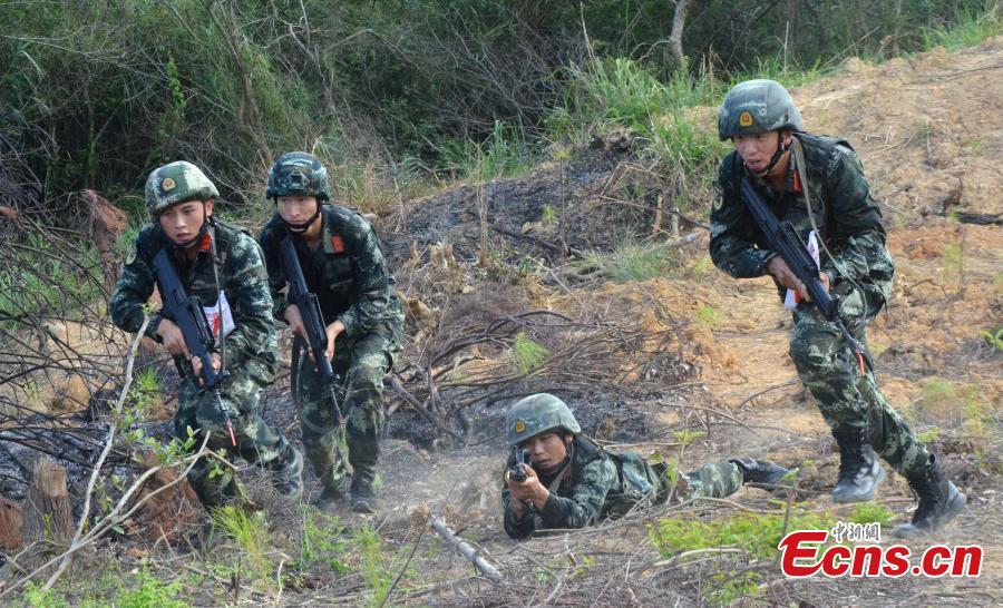 Some 200 Chinese armed police officers receive training in Fangchenggang City, South China’s Guangxi Zhuang Autonomous Region. The week-long training includes demanding search and rescue operations in mountain and forest settings, and rapid response to infection outbreak scenarios. (Photo: China News Service/Cui Cheng)