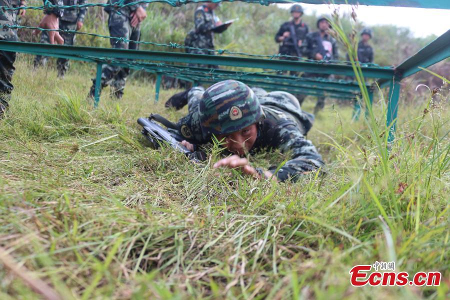 Some 200 Chinese armed police officers receive training in Fangchenggang City, South China’s Guangxi Zhuang Autonomous Region. The week-long training includes demanding search and rescue operations in mountain and forest settings, and rapid response to infection outbreak scenarios. (Photo: China News Service/Cui Cheng)