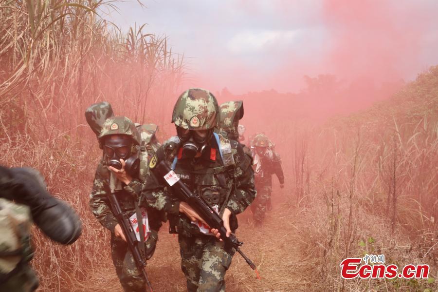 Some 200 Chinese armed police officers receive training in Fangchenggang City, South China’s Guangxi Zhuang Autonomous Region. The week-long training includes demanding search and rescue operations in mountain and forest settings, and rapid response to infection outbreak scenarios. (Photo: China News Service/Cui Cheng)