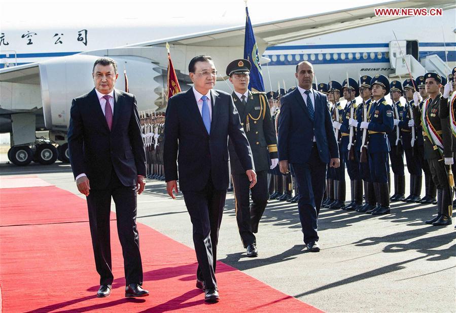 Chinese Premier Li Keqiang, accompanied by Tajik Prime Minister Kokhir Rasulzoda, inspects the guard of honor during a welcome ceremony at the Dushanbe international airport in Dushanbe, Tajikistan, Oct. 11, 2018. Li Keqiang arrived here on Thursday for an annual meeting of heads of government of the Shanghai Cooperation Organization member states and an official visit to Tajikistan. (Xinhua/Li Tao)