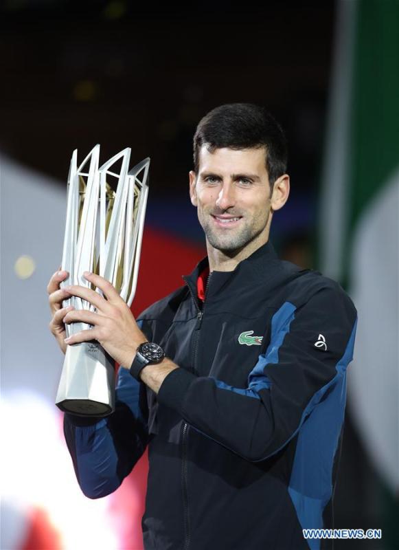 Novak Djokovic of Serbia poses with the trophy during the awarding ceremony of the men\'s singles event at 2018 ATP Shanghai Masters tennis tournament in Shanghai, east China, Oct. 14, 2018. Novak Djokovic won 2-0 in the final and claimed the title of the event. (Xinhua/Ding Ting)