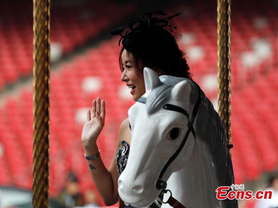 Ruby Lin Xinru, actress, poses for a photo in the 8th Longines Equestrian Beijing Masters at the National Stadium in Beijing, Oct. 14, 2018. One of the grandest international equestrian events in China, it was jointly organized by Chinese Equestrian Association and the National Stadium. A total of 251 pairs of horses and riders joined the competition from Oct. 12 to 14, with the total prize money of 2.33 million yuan. (Photo: China News Service/Liu Guanguan)